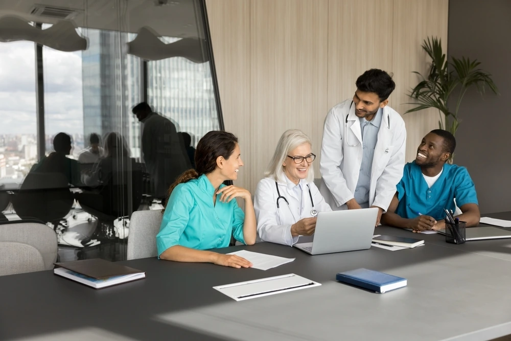 group-smiling-general-practitioners-gathered-together-for-clinical-evaluation