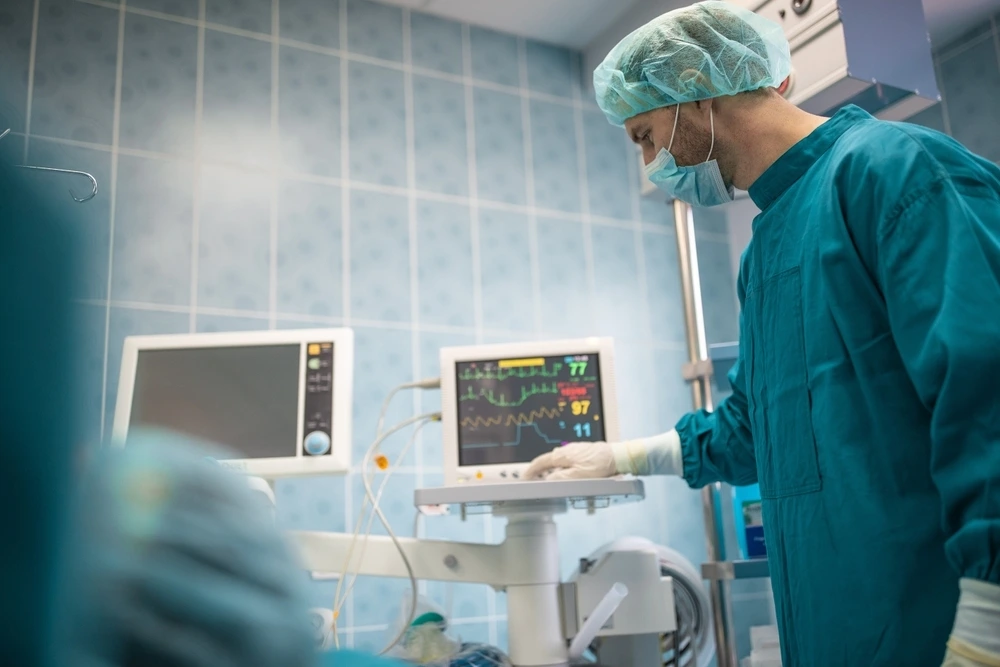 male-surgeon-keeping-track-vital-functions