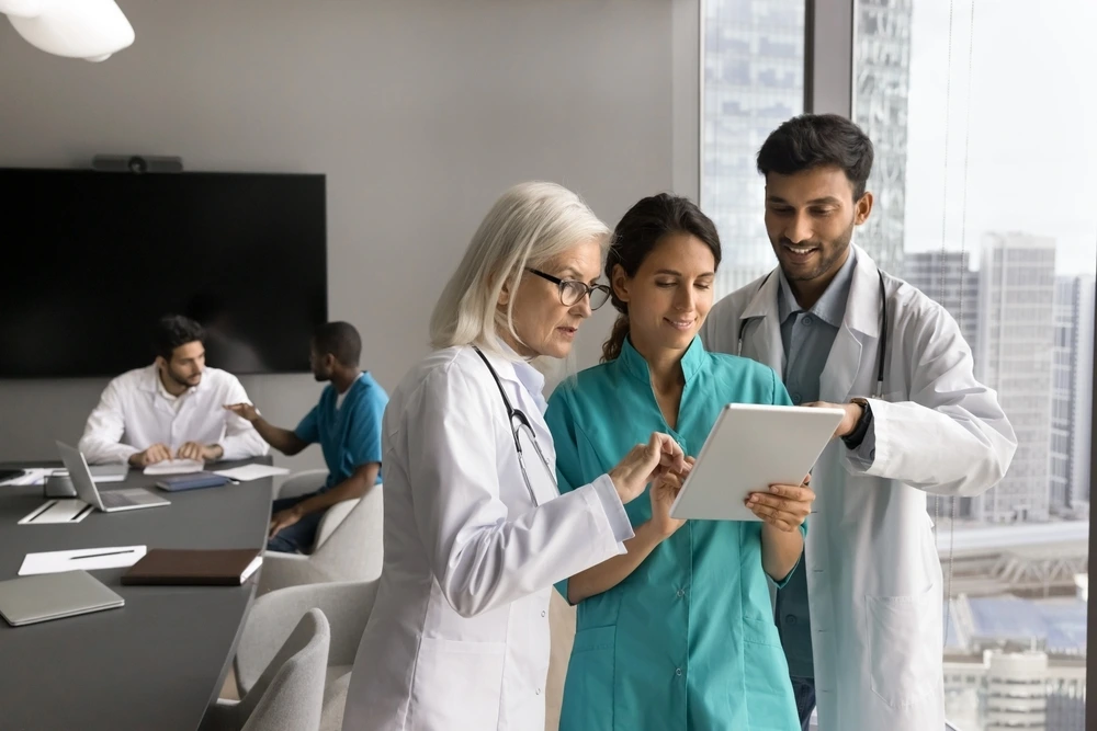 three-diverse-general-practitioners-uniforms-working